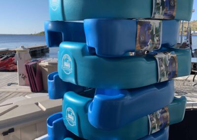 Stacked blue floating swim platforms on dock