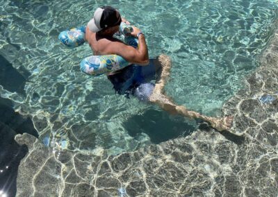 Hip stretch: Personal Flotation Device like no others. Headrest & Armrest Pillow, 2 Cup Holders and Flotation Device in One.